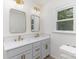 Bright bathroom with double sinks, modern fixtures, and a large window at 7212 Canyon Dr, Charlotte, NC 28262