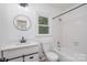 Cozy bathroom featuring a single sink vanity, and a shower-tub combination at 7212 Canyon Dr, Charlotte, NC 28262