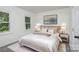 Cozy bedroom features a bright window, and contemporary decor at 7212 Canyon Dr, Charlotte, NC 28262