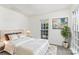 Inviting bedroom features soft carpet, a large window, and a comfortable, modern bed setup at 7212 Canyon Dr, Charlotte, NC 28262