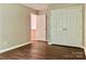 Bedroom with wood look flooring and closet for storage at 7401 Kinsmore Ln, Charlotte, NC 28269