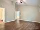 Bedroom with ceiling fan, doorway and wood look floors at 7401 Kinsmore Ln, Charlotte, NC 28269