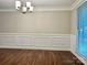Dining room featuring wainscoting and hardwood floors at 7401 Kinsmore Ln, Charlotte, NC 28269