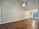 Spacious living room featuring hardwood floors, high ceilings, and natural light at 7401 Kinsmore Ln, Charlotte, NC 28269
