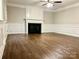 Spacious living room with a fireplace and detailed trim work, ready for personalization at 7401 Kinsmore Ln, Charlotte, NC 28269