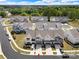 Aerial view of a community showcasing townhomes, green spaces, and streetscapes at 8107 Houser St, Cornelius, NC 28031