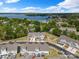 Breathtaking aerial view of townhomes near a scenic lake and lush greenery at 8107 Houser St, Cornelius, NC 28031