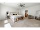 Spacious bedroom featuring a comfortable bed, modern decor, and ample natural light, creating a serene and stylish retreat at 8107 Houser St, Cornelius, NC 28031