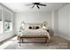 Serene bedroom with a comfortable bed, stylish decor, and a ceiling fan, creating a relaxing and inviting atmosphere at 8107 Houser St, Cornelius, NC 28031