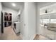 Laundry room with washer and dryer, next to a bedroom and closet at 8107 Houser St, Cornelius, NC 28031