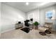 Office space featuring a desk, an ergonomic chair, and a comfortable lounge chair at 8107 Houser St, Cornelius, NC 28031