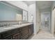 Elegant bathroom with double vanity, granite countertops and designer finishes create a luxurious spa-like experience at 8473 Bing Cherry Dr, Denver, NC 28037