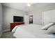 Cozy bedroom featuring neutral decor, a ceiling fan, and a view into the dining area at 8473 Bing Cherry Dr, Denver, NC 28037