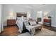 Spacious bedroom featuring a comfortable bed, stylish furniture, and an ensuite bathroom provides a private retreat at 8473 Bing Cherry Dr, Denver, NC 28037
