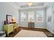 Bedroom with tray ceiling, hardwood floors and natural light at 8473 Bing Cherry Dr, Denver, NC 28037