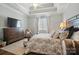 Comfortable bedroom features a large bed, stylish furniture and neutral tones for a relaxing retreat at 8473 Bing Cherry Dr, Denver, NC 28037