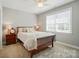 Cozy bedroom featuring a comfortable bed, neutral tones, and natural light creates a tranquil sanctuary at 8473 Bing Cherry Dr, Denver, NC 28037