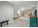 Bonus room featuring neutral colors, a ceiling fan, and versatile space for relaxation or recreation at 8473 Bing Cherry Dr, Denver, NC 28037