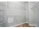 Well-organized walk-in closet with ample shelving and storage options to maximize space and efficiency at 8473 Bing Cherry Dr, Denver, NC 28037