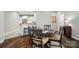 Dining room featuring hardwood floors and an open concept kitchen at 8473 Bing Cherry Dr, Denver, NC 28037