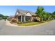 Single story brick home with a screened in porch on a quiet tree-lined street at 8473 Bing Cherry Dr, Denver, NC 28037