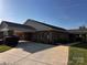 Well manicured exterior with covered entryway and concrete driveway at 8473 Bing Cherry Dr, Denver, NC 28037