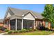 Attractive single story brick house with screened in porch and manicured lawn and landscaping at 8473 Bing Cherry Dr, Denver, NC 28037