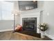 Elegant fireplace with a decorative mantel, stone hearth, and hardwood floors at 8473 Bing Cherry Dr, Denver, NC 28037