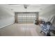 Spacious garage featuring an automatic garage door and ample space for parking and storage at 8473 Bing Cherry Dr, Denver, NC 28037