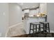 Kitchen eat-in bar area with granite counters and two high stools at 8473 Bing Cherry Dr, Denver, NC 28037