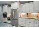 Kitchen featuring stainless steel appliances and white cabinets at 8473 Bing Cherry Dr, Denver, NC 28037