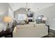 Comfortable living room with vaulted ceiling, fireplace, ceiling fan and hardwood flooring at 8473 Bing Cherry Dr, Denver, NC 28037