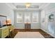 Bright office space with hardwood floors, natural light and neutral colors provide an inviting workspace at 8473 Bing Cherry Dr, Denver, NC 28037