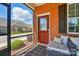 Cozy screened in porch with comfortable seating and views of the neighborhood at 8473 Bing Cherry Dr, Denver, NC 28037