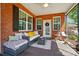 Comfortable screened porch with ample seating, rug, and overhead fan for relaxing outdoors at 8473 Bing Cherry Dr, Denver, NC 28037