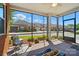 Relax on this screened porch, offering neighborhood views and comfortable seating in a bright setting at 8473 Bing Cherry Dr, Denver, NC 28037