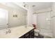 Bright bathroom featuring a double sink vanity, large mirror, and a shower with a tub combination at 10417 Ebbets Rd, Charlotte, NC 28273