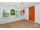 Inviting bedroom with natural light from two windows and neutral carpet flooring at 10417 Ebbets Rd, Charlotte, NC 28273