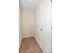 Functional closet space with a white door and beige carpet, providing essential storage at 10417 Ebbets Rd, Charlotte, NC 28273