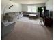 Cozy living room featuring a sectional couch and natural light at 10417 Ebbets Rd, Charlotte, NC 28273