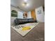 Open concept living room with a modern sectional couch and stylish decor at 10417 Ebbets Rd, Charlotte, NC 28273