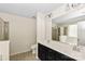 Spacious bathroom featuring double sinks, vanity and a shower at 10417 Ebbets Rd, Charlotte, NC 28273