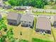 Aerial view of homes showcasing well-manicured lawns and a community pool in a desirable neighborhood setting at 115 Haddonsfield Dr, Mooresville, NC 28115
