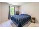 Cozy bedroom featuring neutral walls, a window, and neutral carpet at 115 Haddonsfield Dr, Mooresville, NC 28115