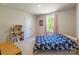 Bright bedroom featuring a large window, and stylish decorations at 115 Haddonsfield Dr, Mooresville, NC 28115