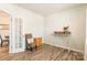 Bright bedroom featuring wood-look flooring, ample natural light, and stylish decor at 115 Haddonsfield Dr, Mooresville, NC 28115