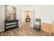 Inviting living area showcasing wood-look floors, bright natural light, and stylish decor at 115 Haddonsfield Dr, Mooresville, NC 28115