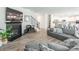 Spacious living room featuring a fireplace, hardwood floors, and neutral color palette at 115 Haddonsfield Dr, Mooresville, NC 28115
