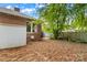 Backyard brick patio with lush landscaping and privacy fence at 119 Wiley Ave, Salisbury, NC 28144