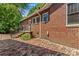 Brick patio with steps leading to the backyard of this classic brick home at 119 Wiley Ave, Salisbury, NC 28144